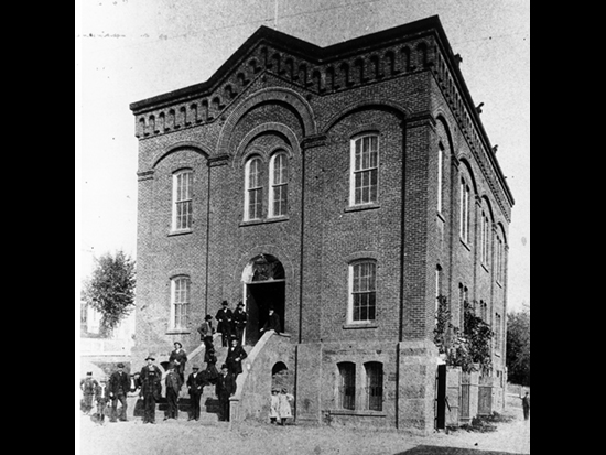 Completed 1864. After an 1862 fire destroyed the county's first courthouse as well as many of the buildings in downtown Jackson, a stone-and-brick courthouse was constructed on the original site. In 1893, a building similar in size and design was constructed next to the courthouse for use as the Hall of Records. An alley separated the two buildings until 1939, when both buildings were enclosed in an art deco exterior. The combined building is still in use as Amador's courthouse. Courtesy Amador County Archives