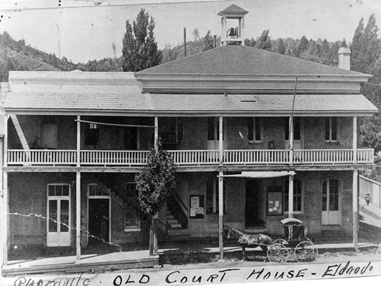 Completed 1861. After several unsuccessful electoral efforts to move the county seat from Coloma to their town, citizens of Placerville in 1857 successfully lobbied the state Legislature to order the move. This two-story building was constructed in Placerville, which prior to 1853 was known as Hangtown because of its reputation for lynchings. The building and its additions burned in 1910, and a new concrete-and-steel courthouse was built on the site. Courtesy El Dorado County Museum