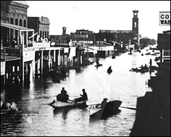 K Street in Sacramento, 1862, rowing east.