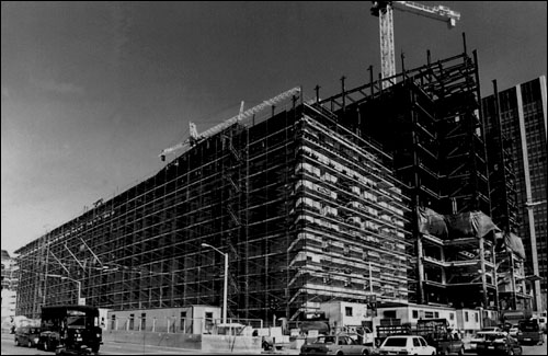 350 McAllister Street (Earl Warren Building), State Building Complex. Construction of the Hiram Johnson component (455 Golden Gate Avenue) of the State Building complex is shown in the background.